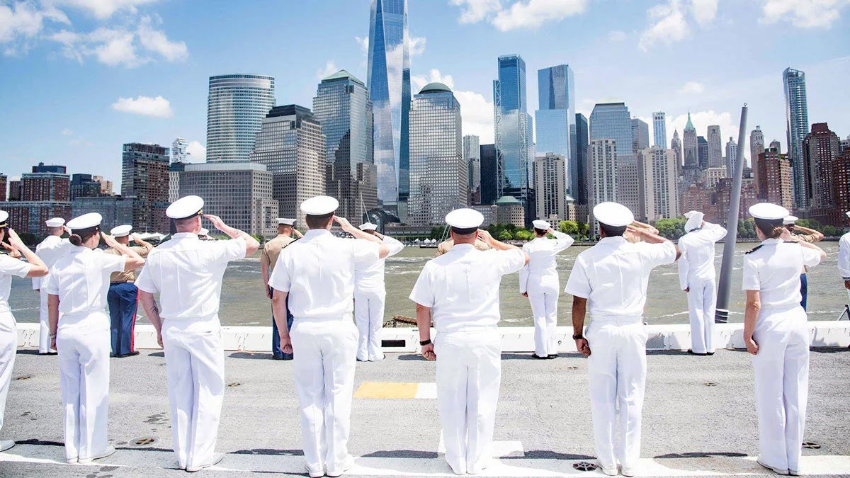 a picture of a captain who salutes in front of the building
